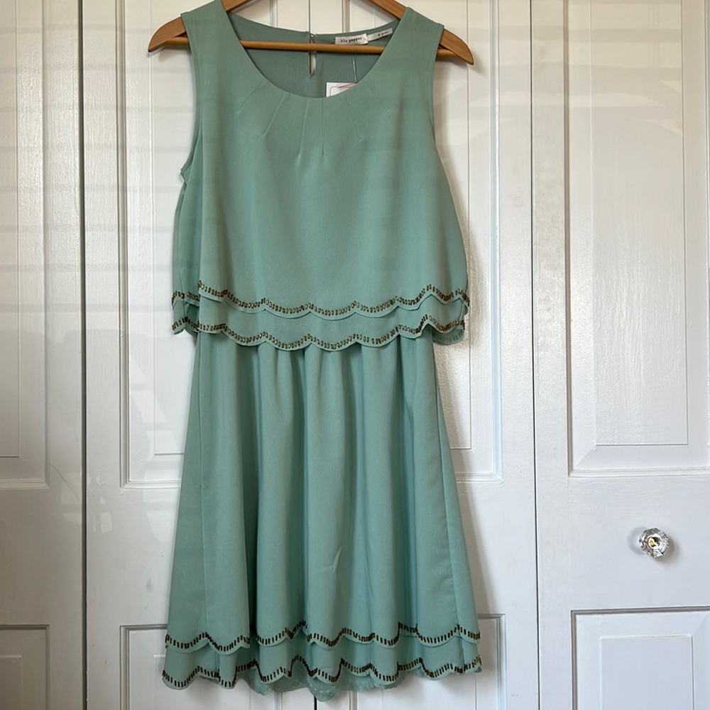 Lightweight sleeveless seafoam dress with gold beaded scalloped hem and waist.